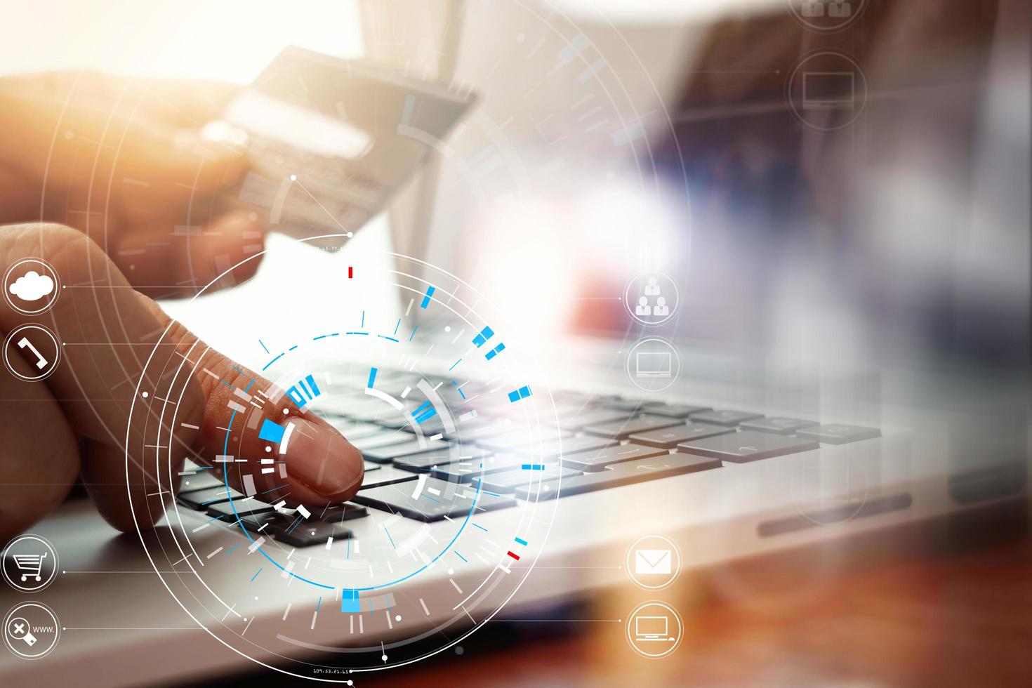 Close up of Hand using credit card and laptop computer on wooden desk with VR icon chart graph diagram photo