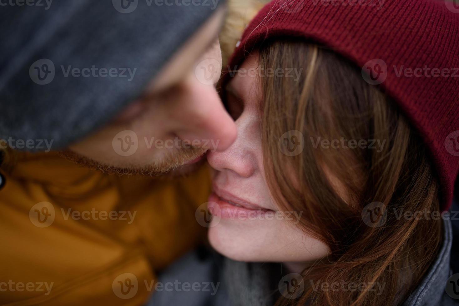 loving pregnant couple are walking outside the city in late autumn. photo