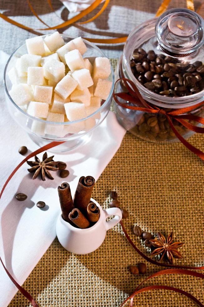 Open a bank with coffee beans lying on sackcloth and napkins photo