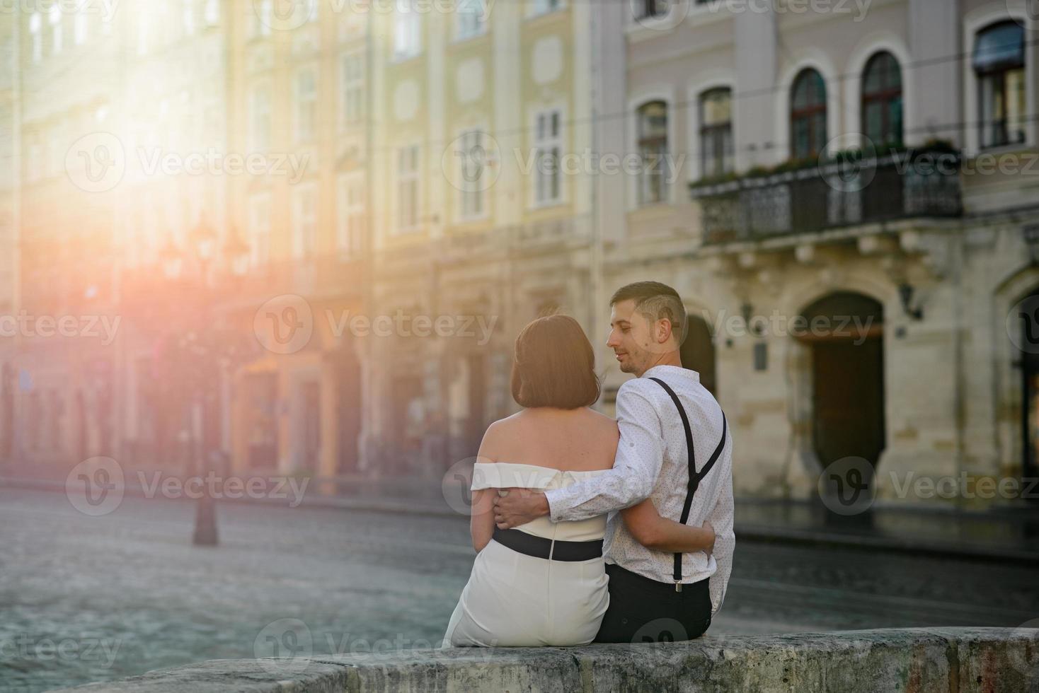 Beautiful stylish couple on a date on the streets in the old city. photo
