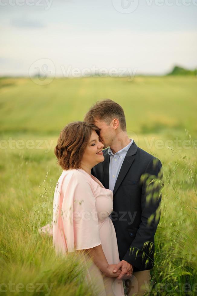 Happy family in the field photo