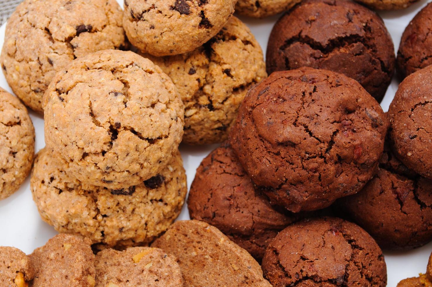 many different types of cookies lay on a plate photo