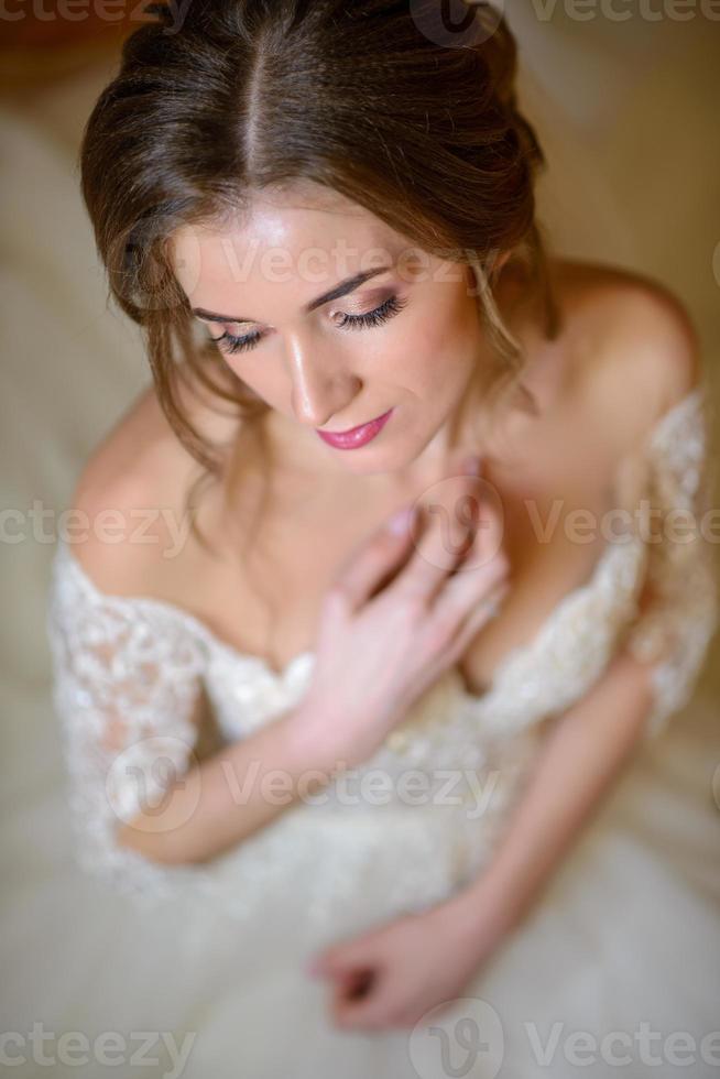 Portrait of a beautiful bride under a veil. photo