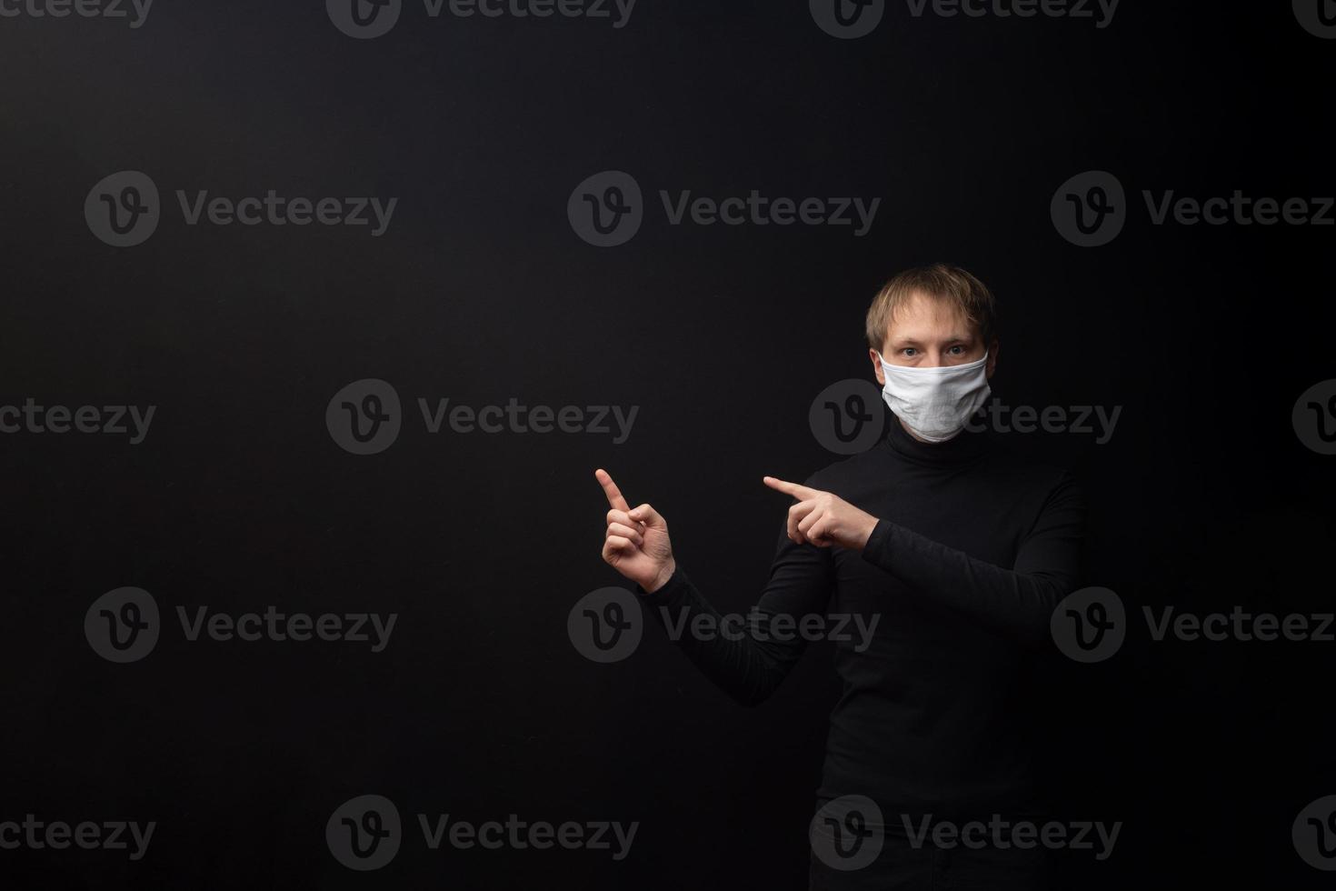 A masked man points to your test. photo