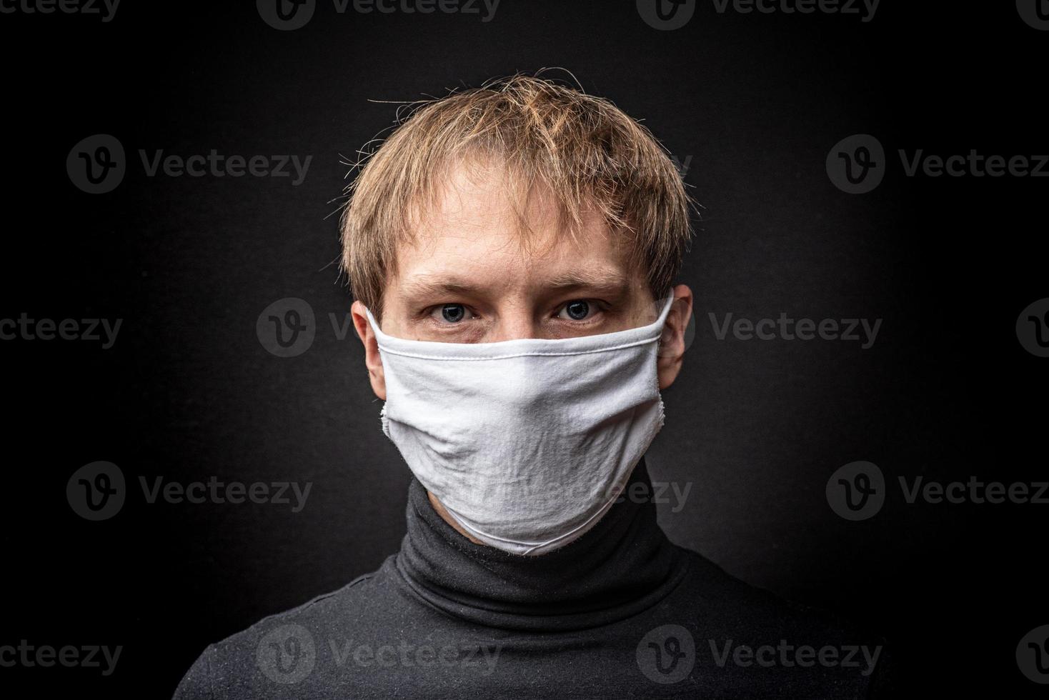 Man in a medical mask is suffocating. photo