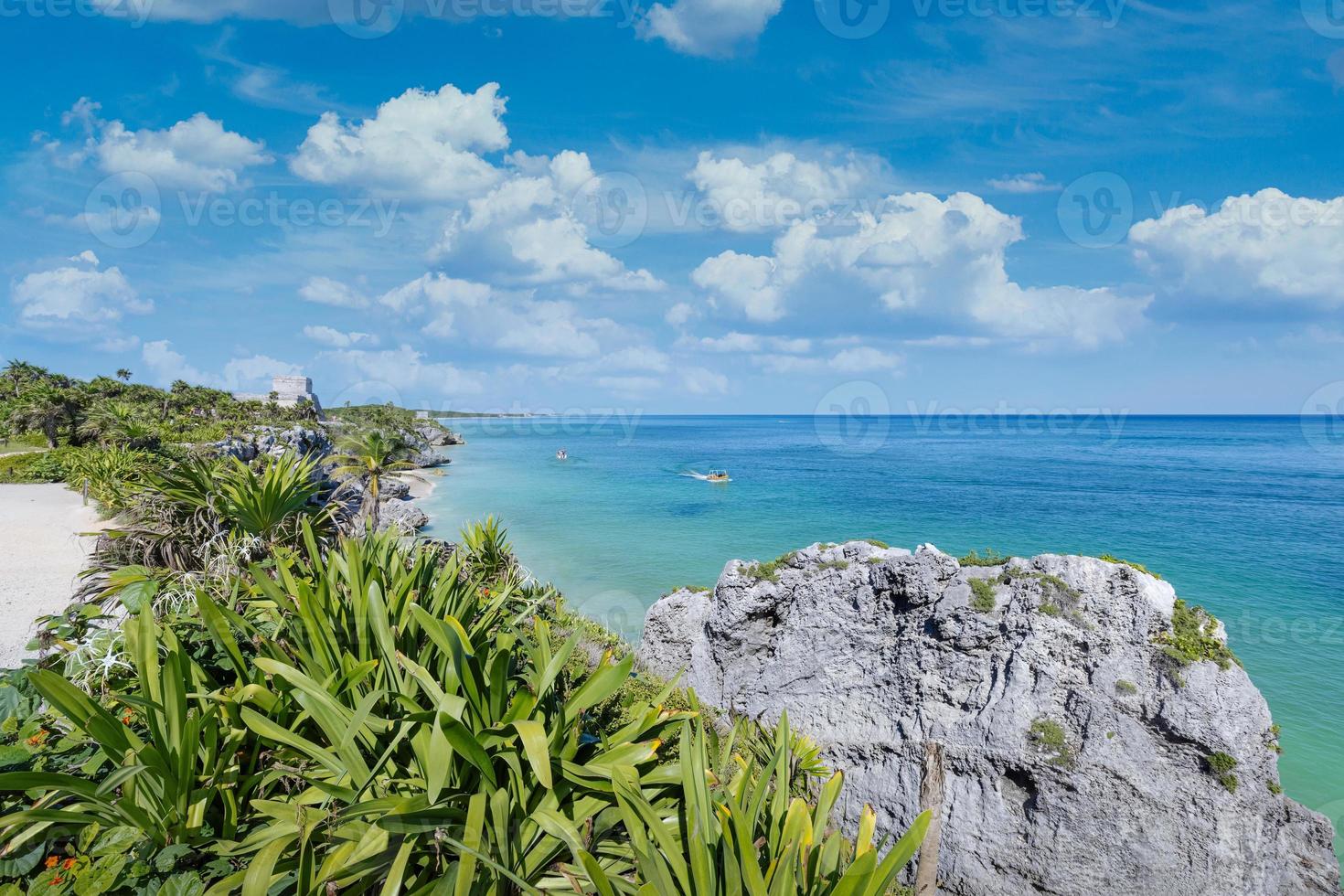 Tulum Archaeological Zone with Mayan pyramids and ruins located on the scenic ocean shore of Quintana Roo province photo