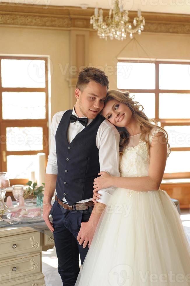 Groom puts a wedding ring on his bride. photo