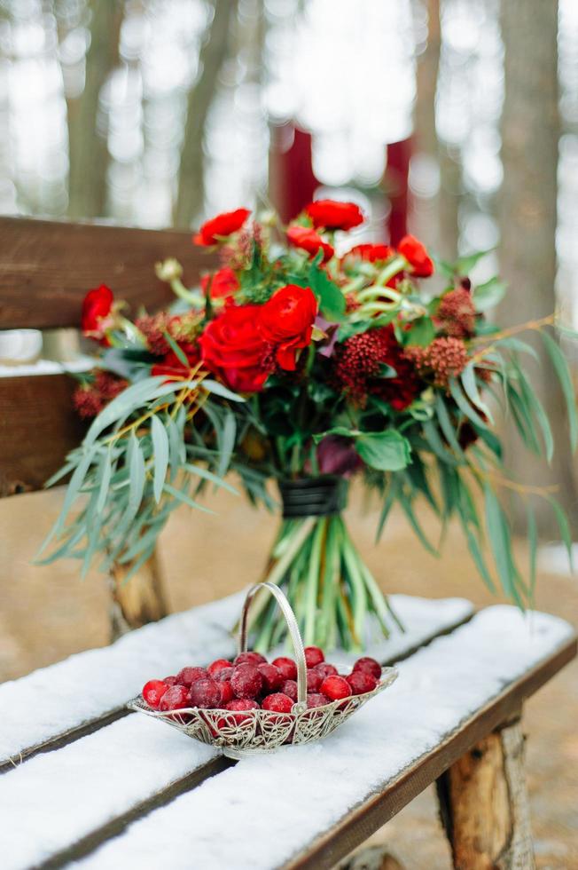 Winter wedding bouquet of red roses photo