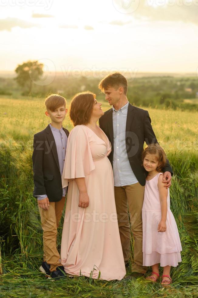 Happy family in the field photo