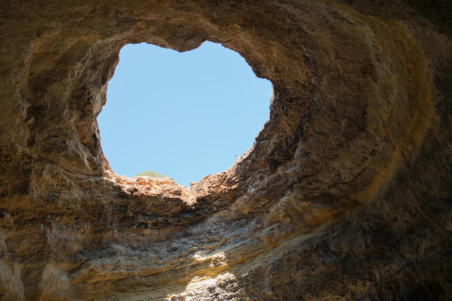 Beautiful natural cave at Benagil, coast of Algarve, Portugal photo