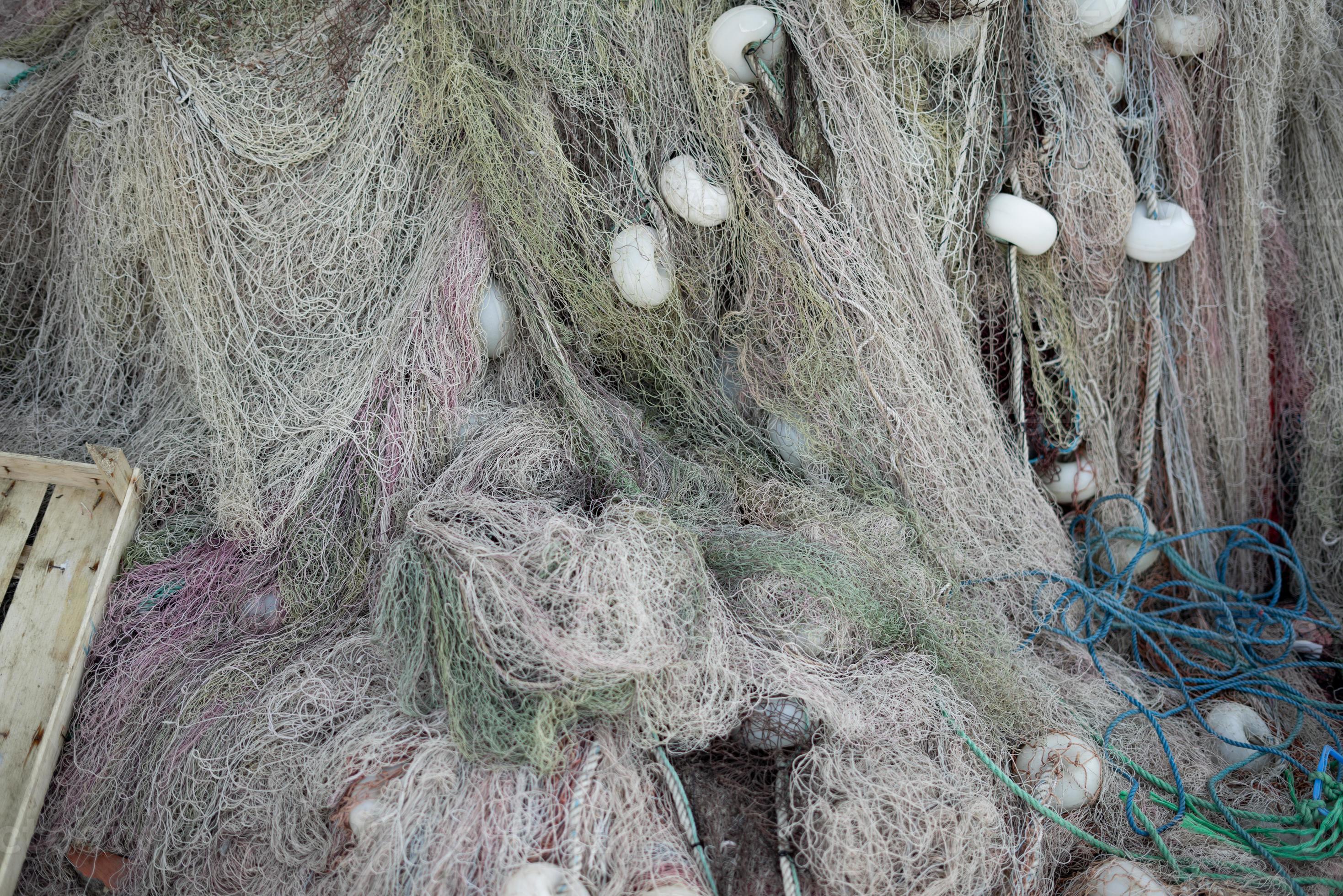 Stacked fishing nets and ropes red, green, blue and white 6925049 Stock  Photo at Vecteezy