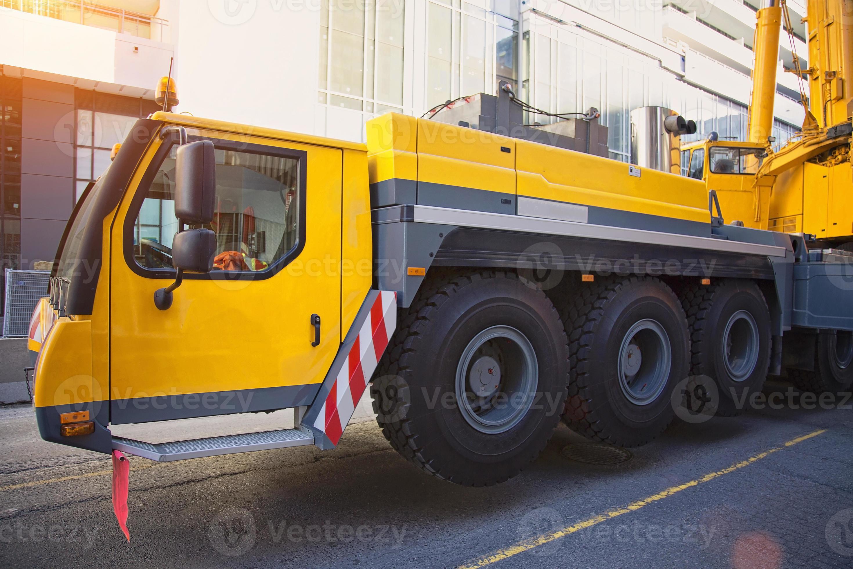 Mobile crane at work at downtown construction site 6927511 Stock Photo