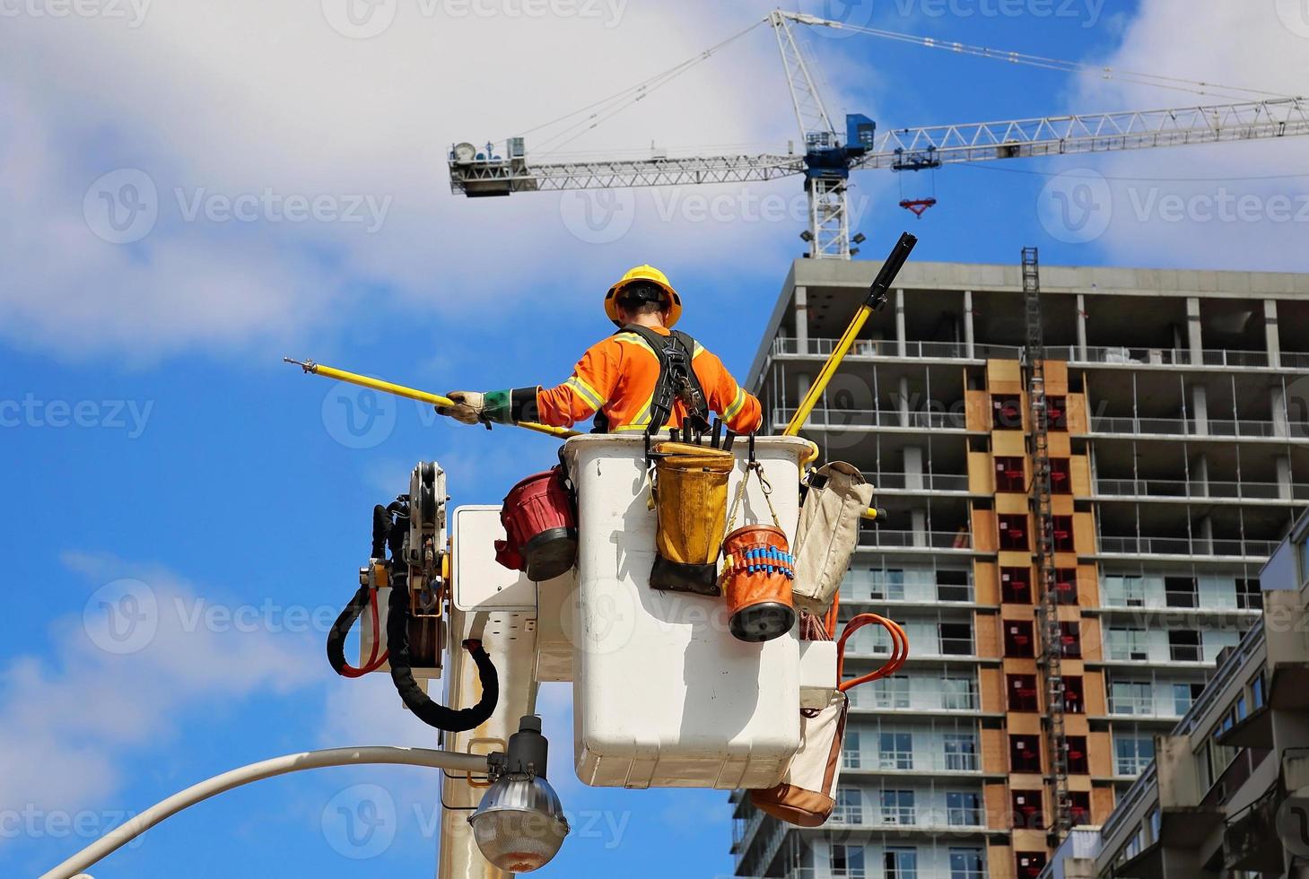 Electrician fixing electric lines photo