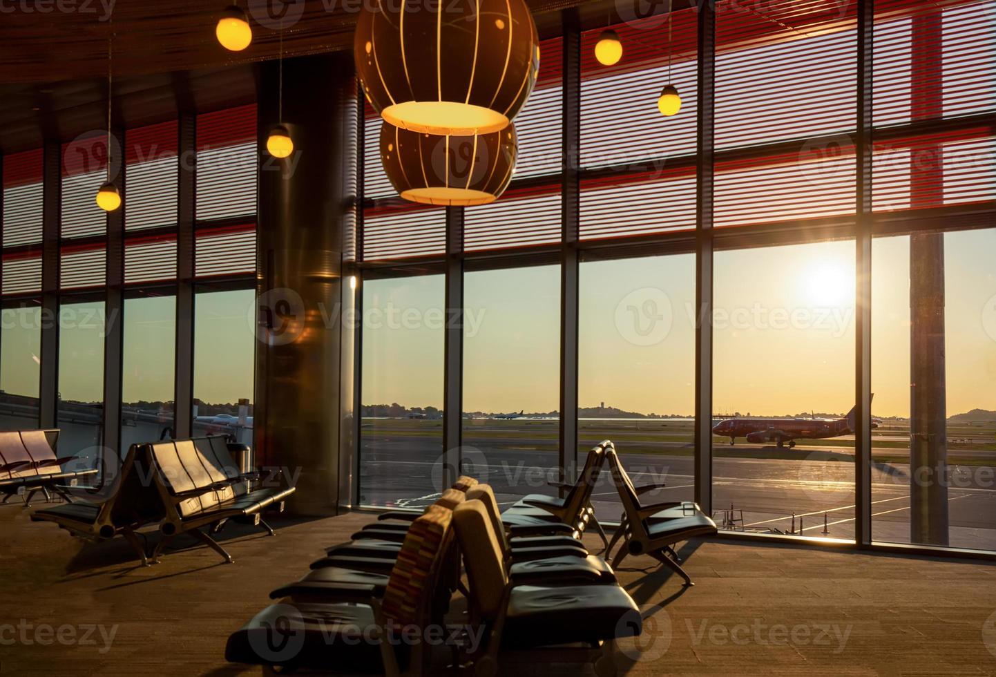 Boston Airport at sunset with planes getting ready for takeoff photo