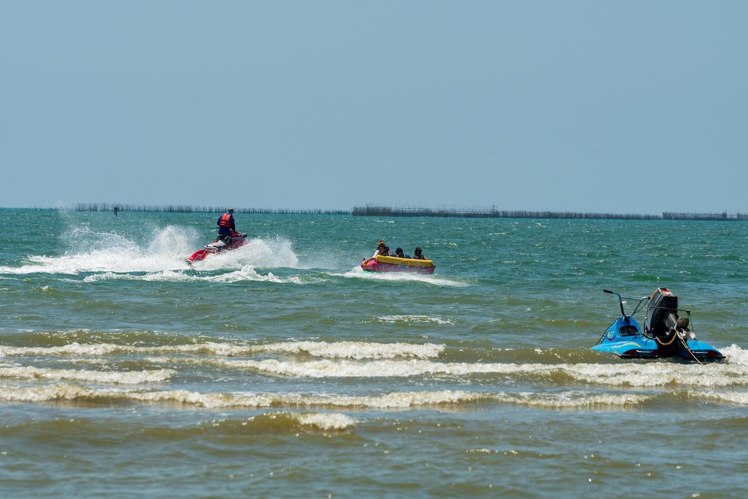 Chonburi, Thailand -06 Mar. 2021 The atmosphere of people playing water activities at Bangsaen beach. photo