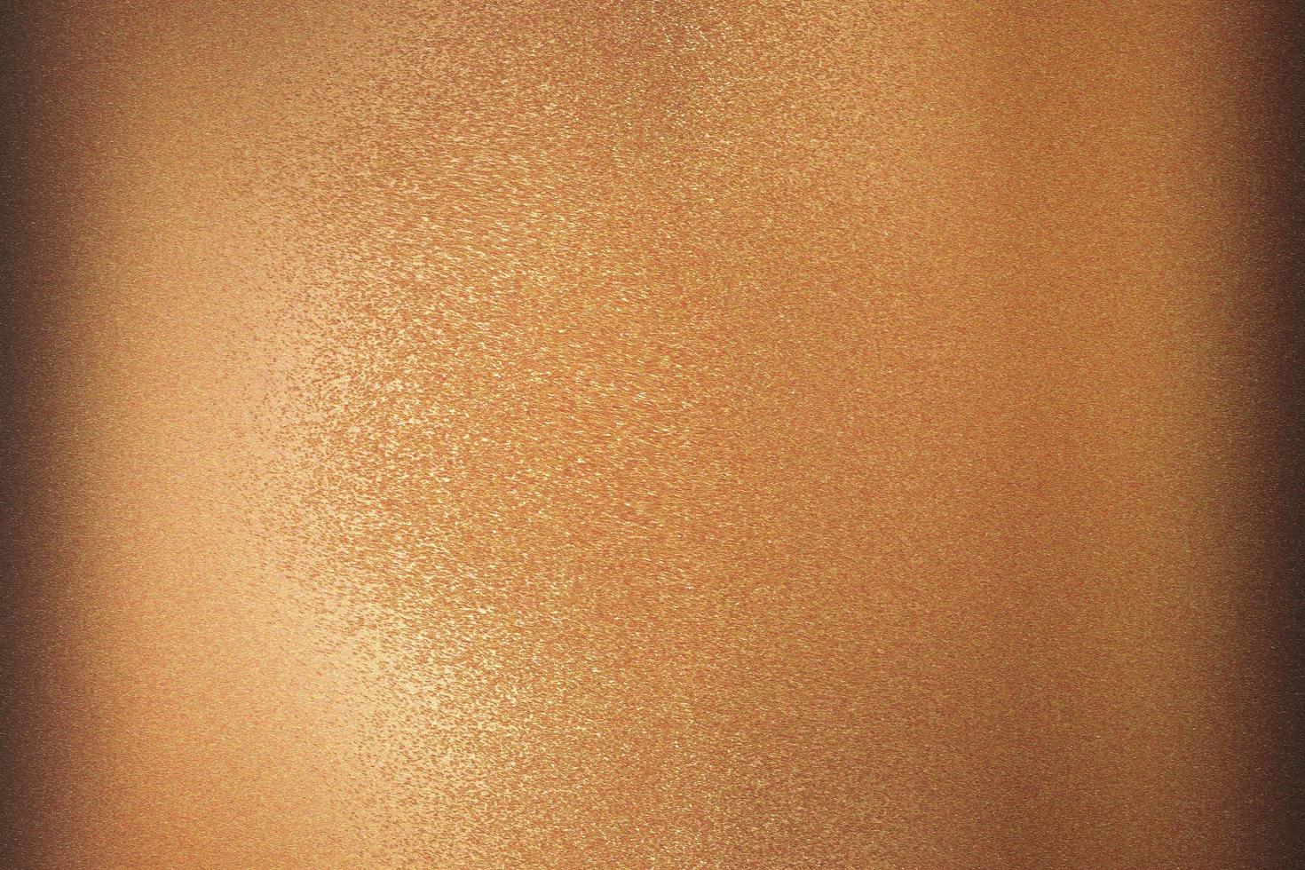 Texture of bronze brushed metallic plate, abstract background photo