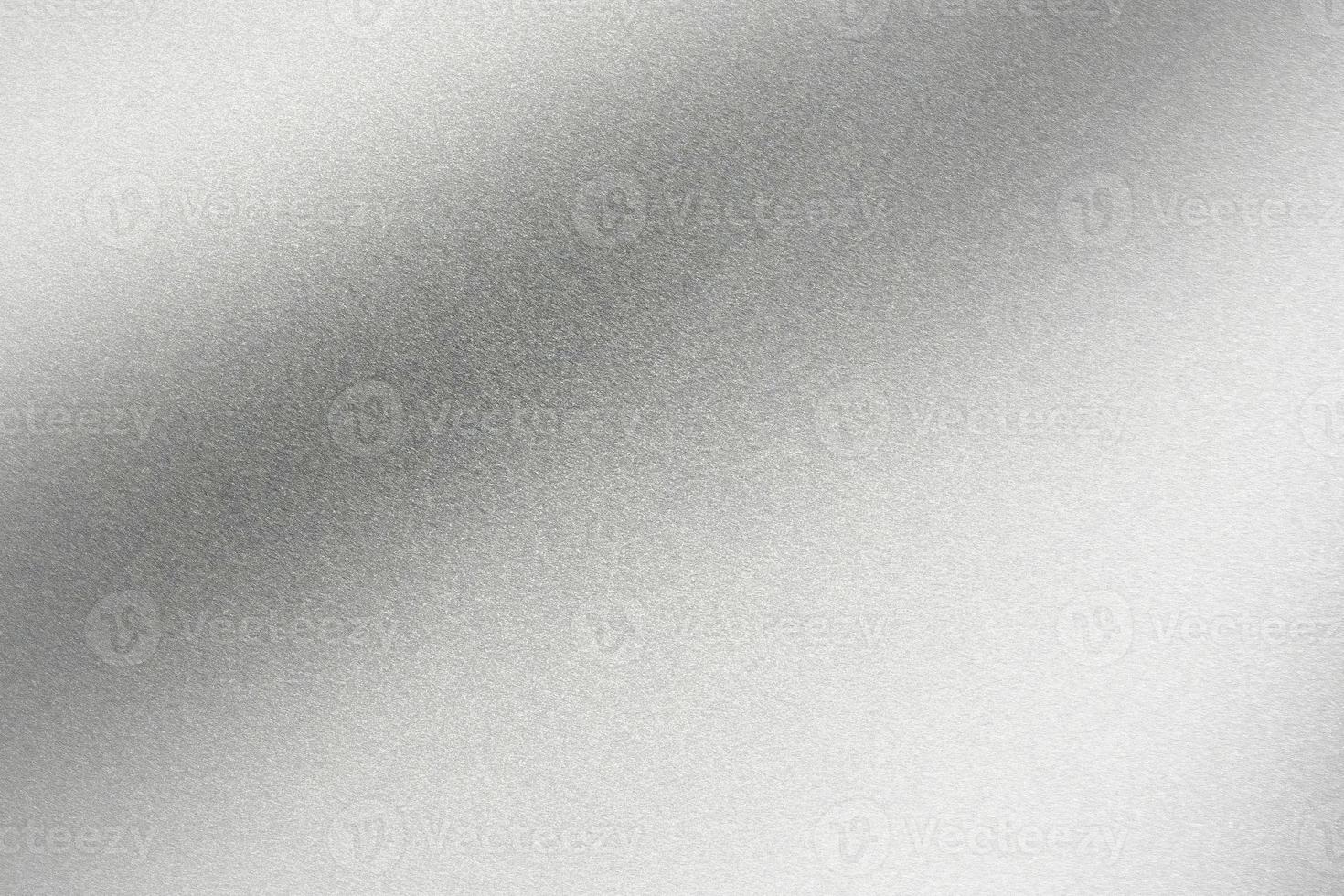 Abstract texture background, light shining on rough silver metallic sheet photo