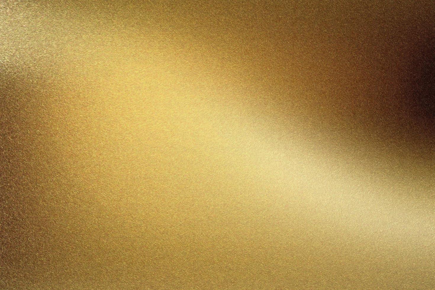 Gold polished metal wall, abstract texture background photo
