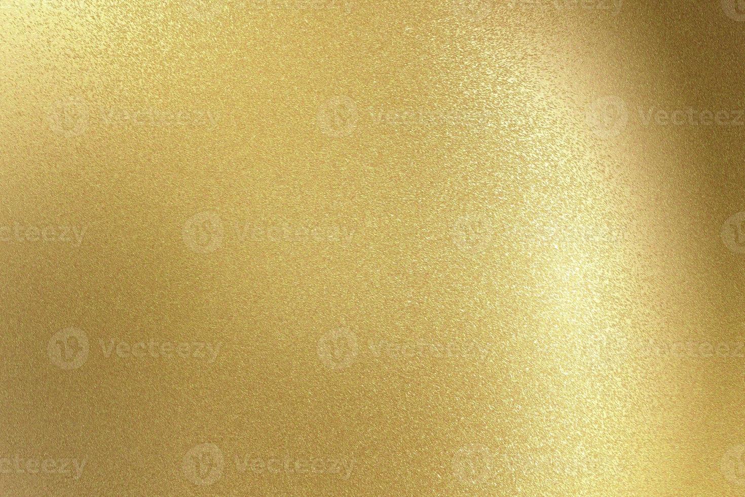 Brushed gold metallic wall with scratched surface, abstract texture background photo