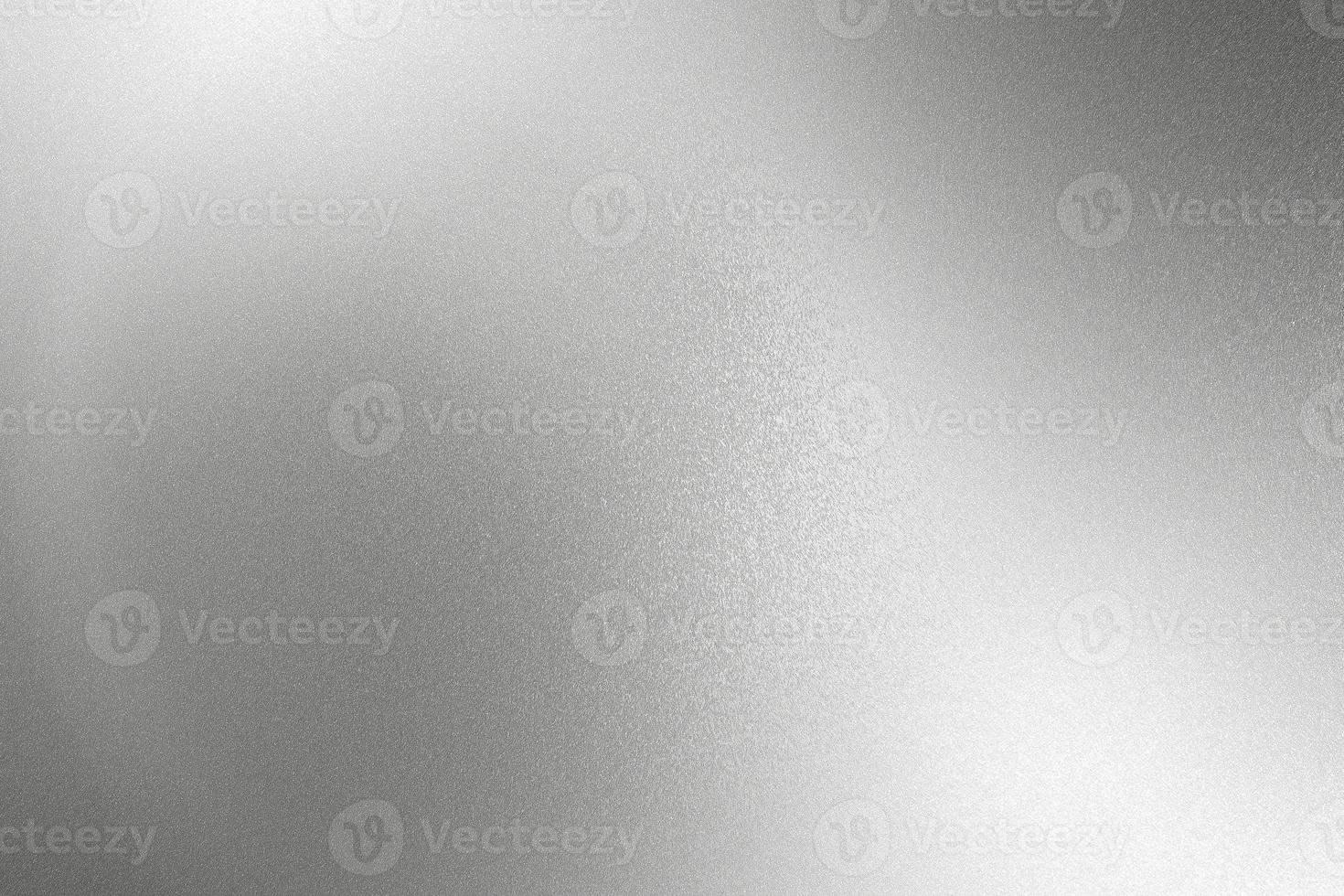 Glowing silver gray foil metal wall with copy space, abstract texture background photo