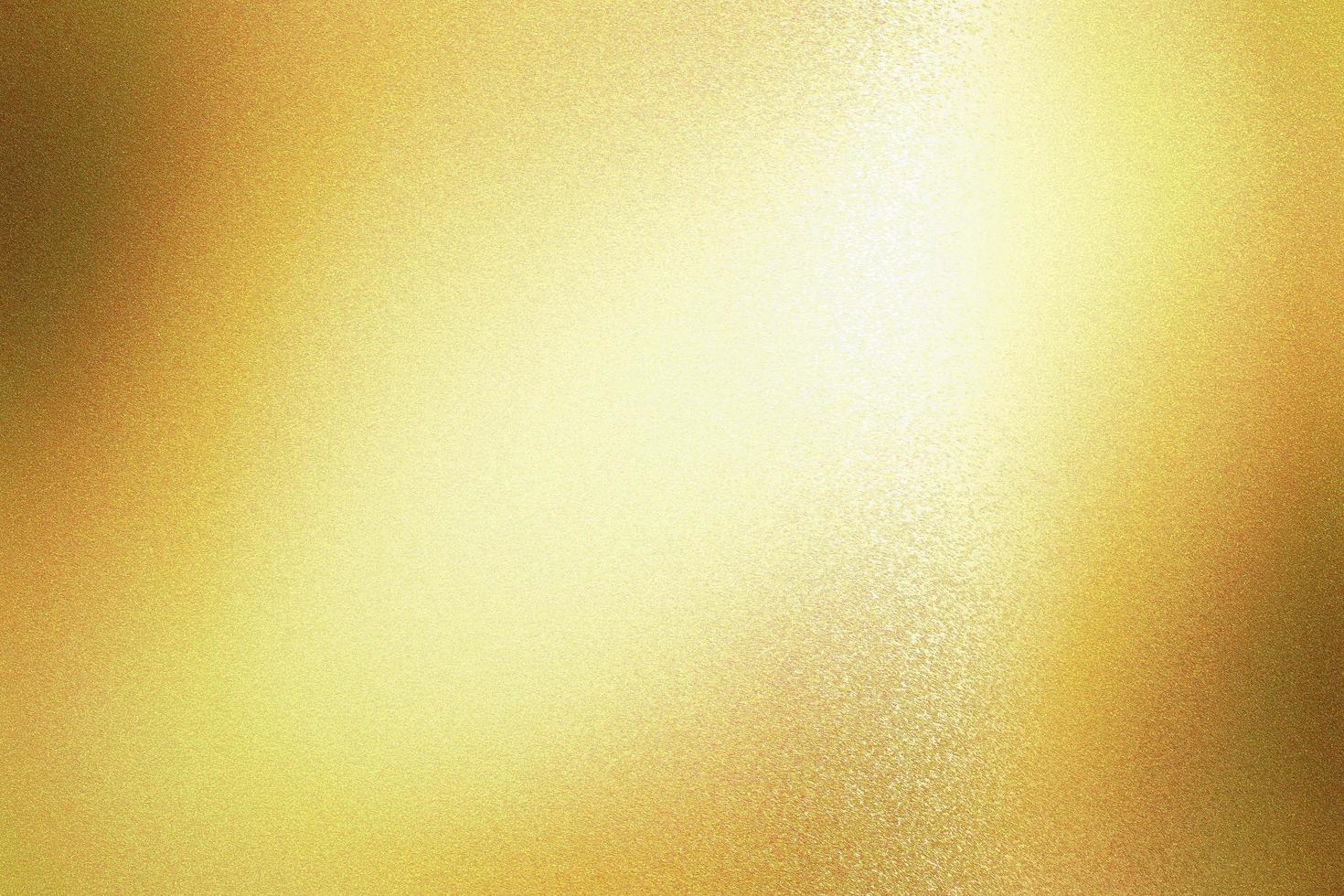 Light shining on gold foil glitter metallic wall with copy space, abstract texture background photo