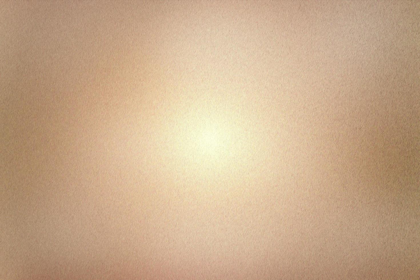 Light shining on rough orange metal wall texture, abstract background photo