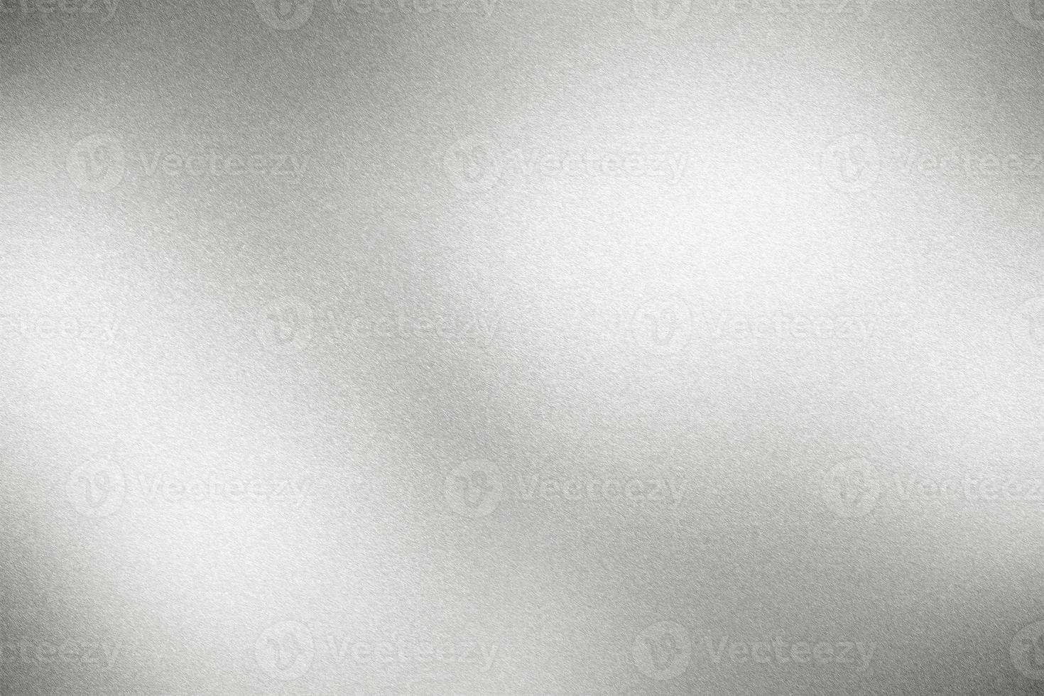 Glowing rough silver metallic plate, abstract texture background photo