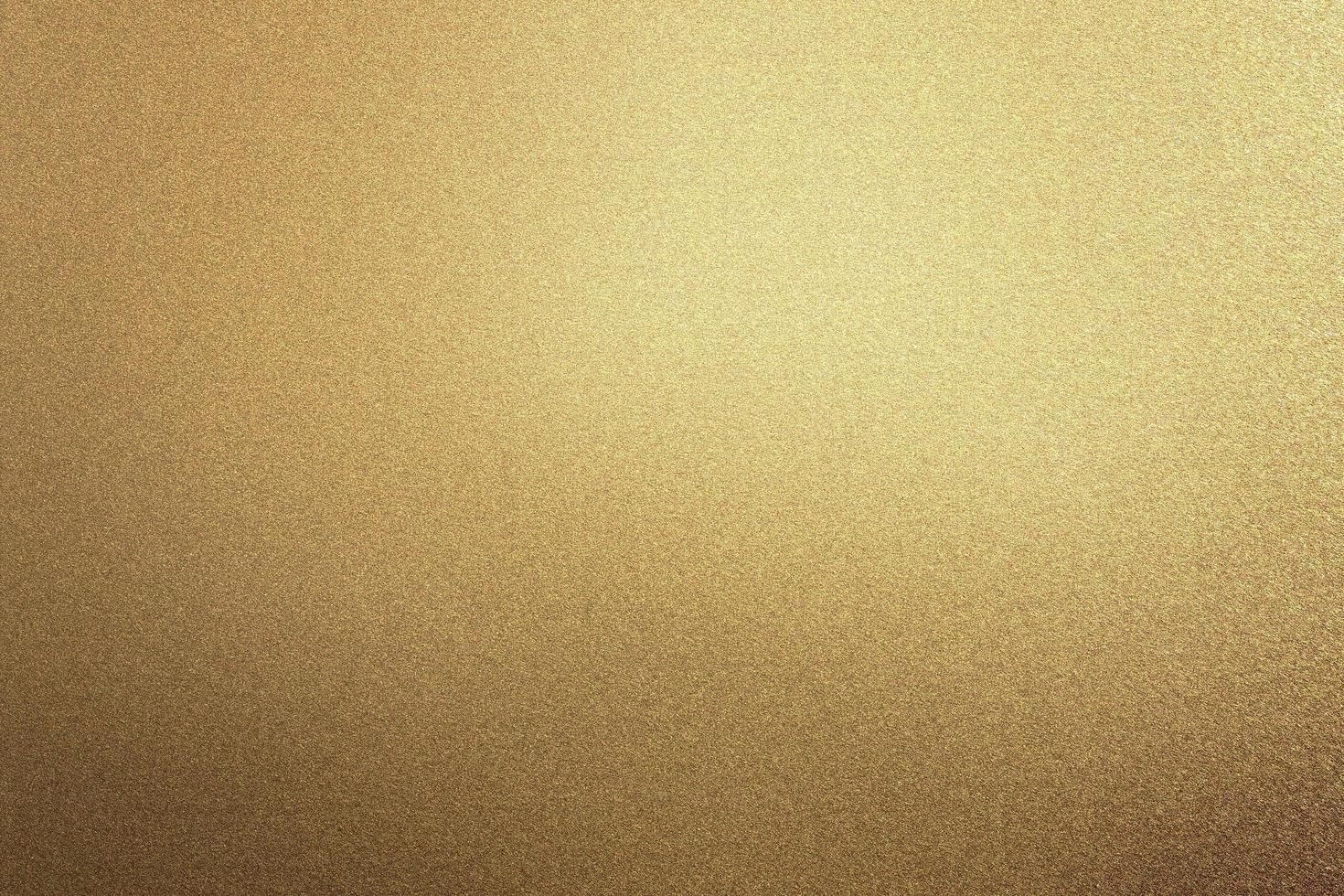 Glowing rough bronze metal board wall, abstract texture background photo