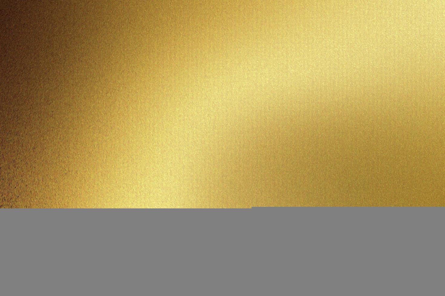 Light shining on gold wave metal plate in dark room, abstract texture background photo