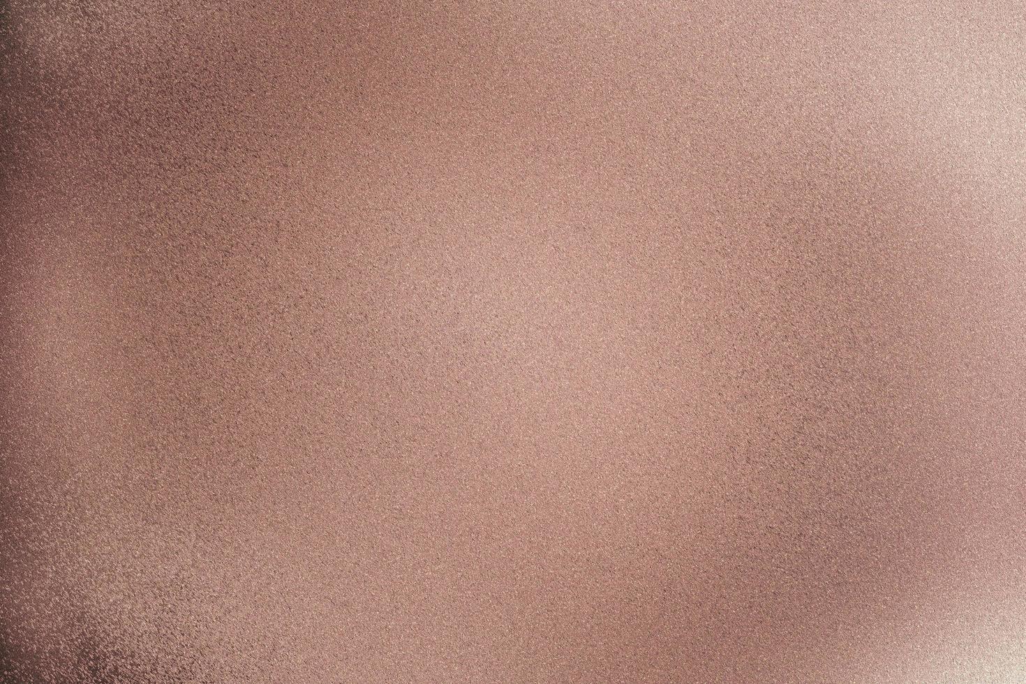Texture of rose gold brushed metallic wall, abstract pattern background photo