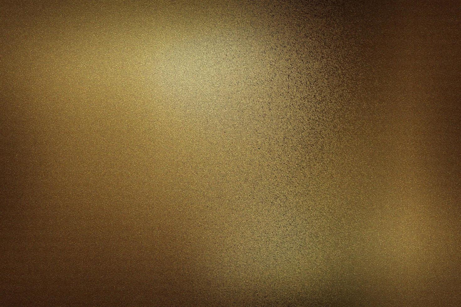 Dark brown foil metallic wall in dark room, abstract texture background photo