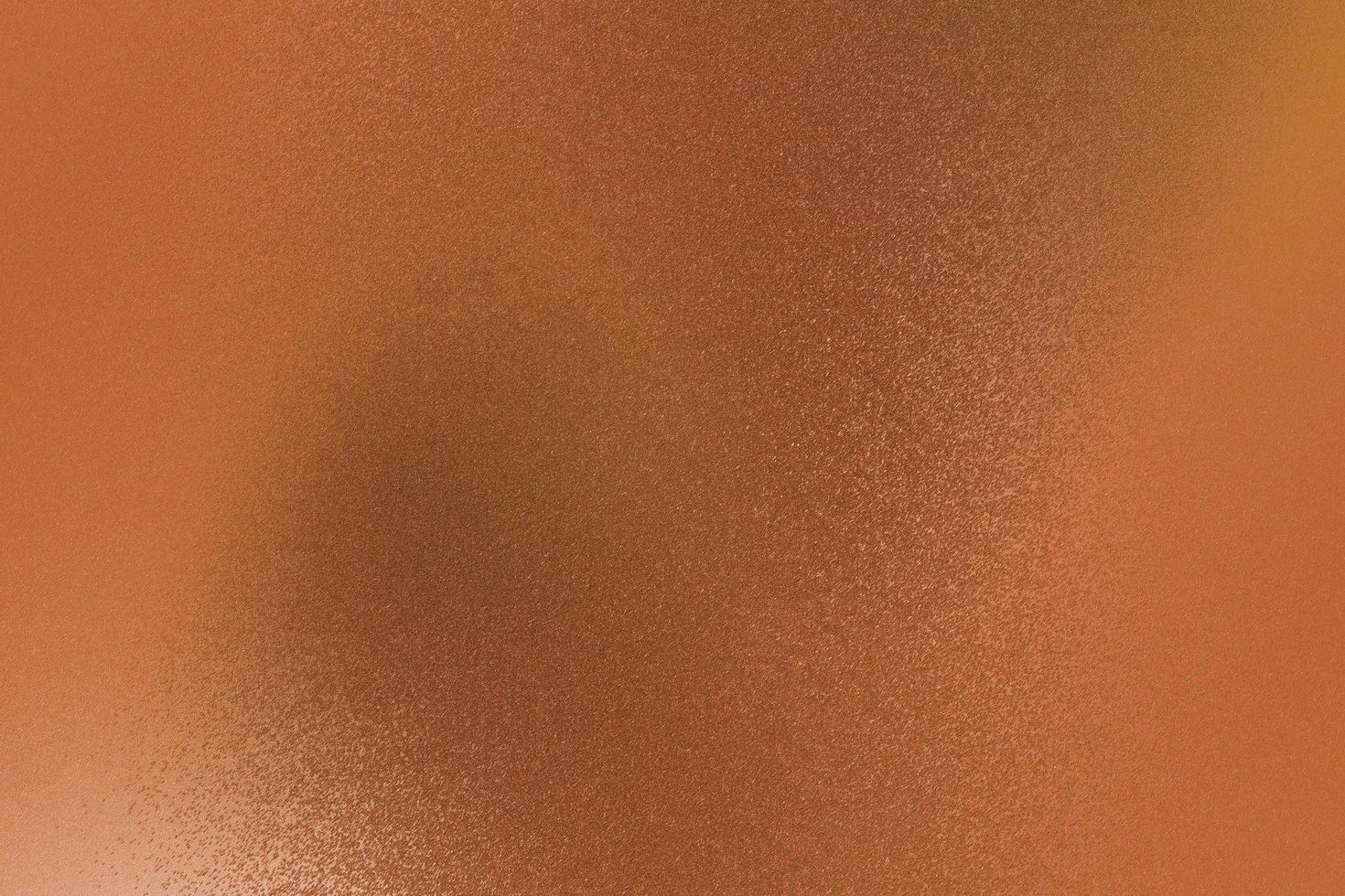 Old brushed brown metallic wall with scratched surface, abstract texture background photo