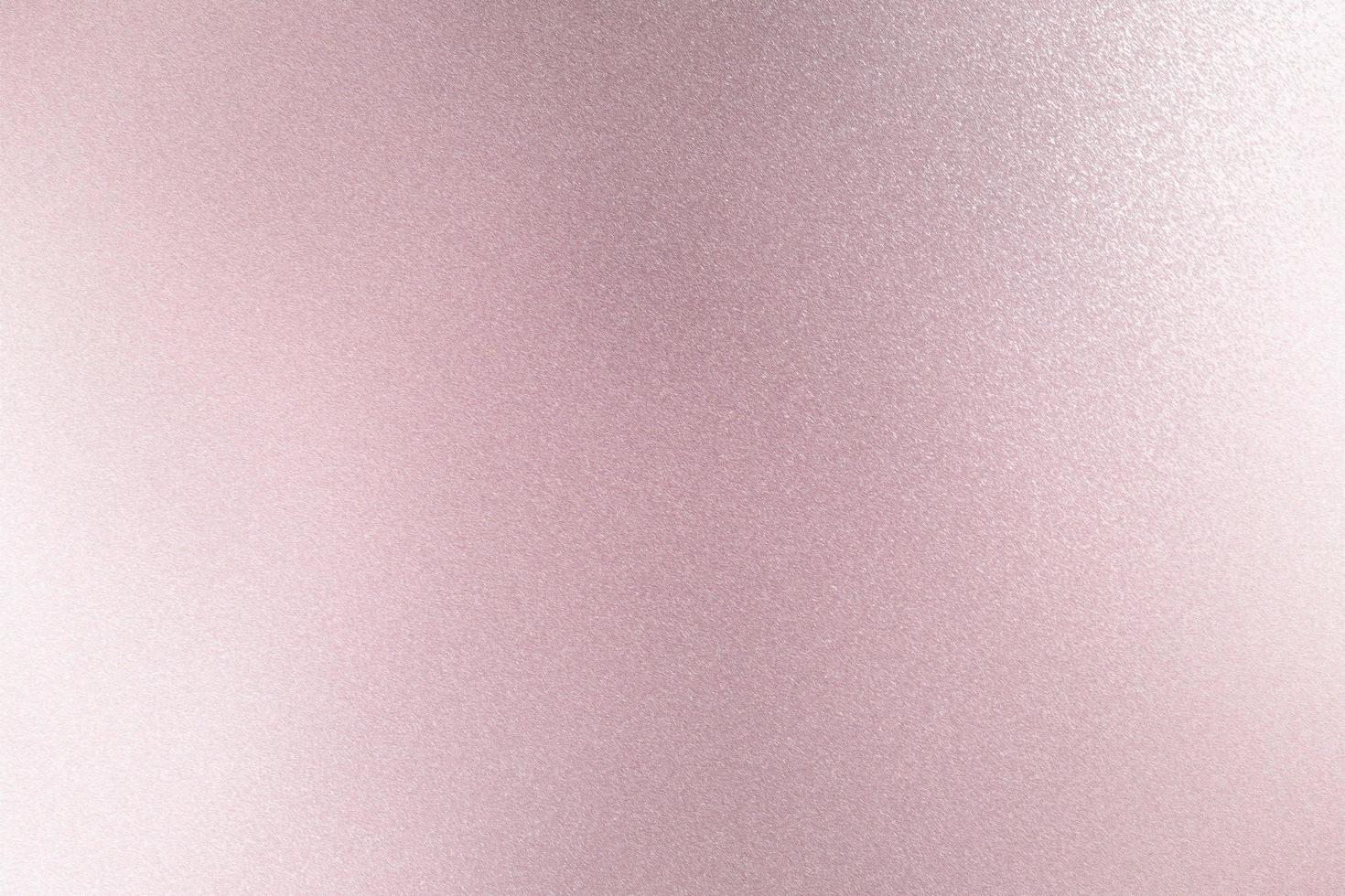 Texture of reflection on rough pink metallic wall, abstract background photo