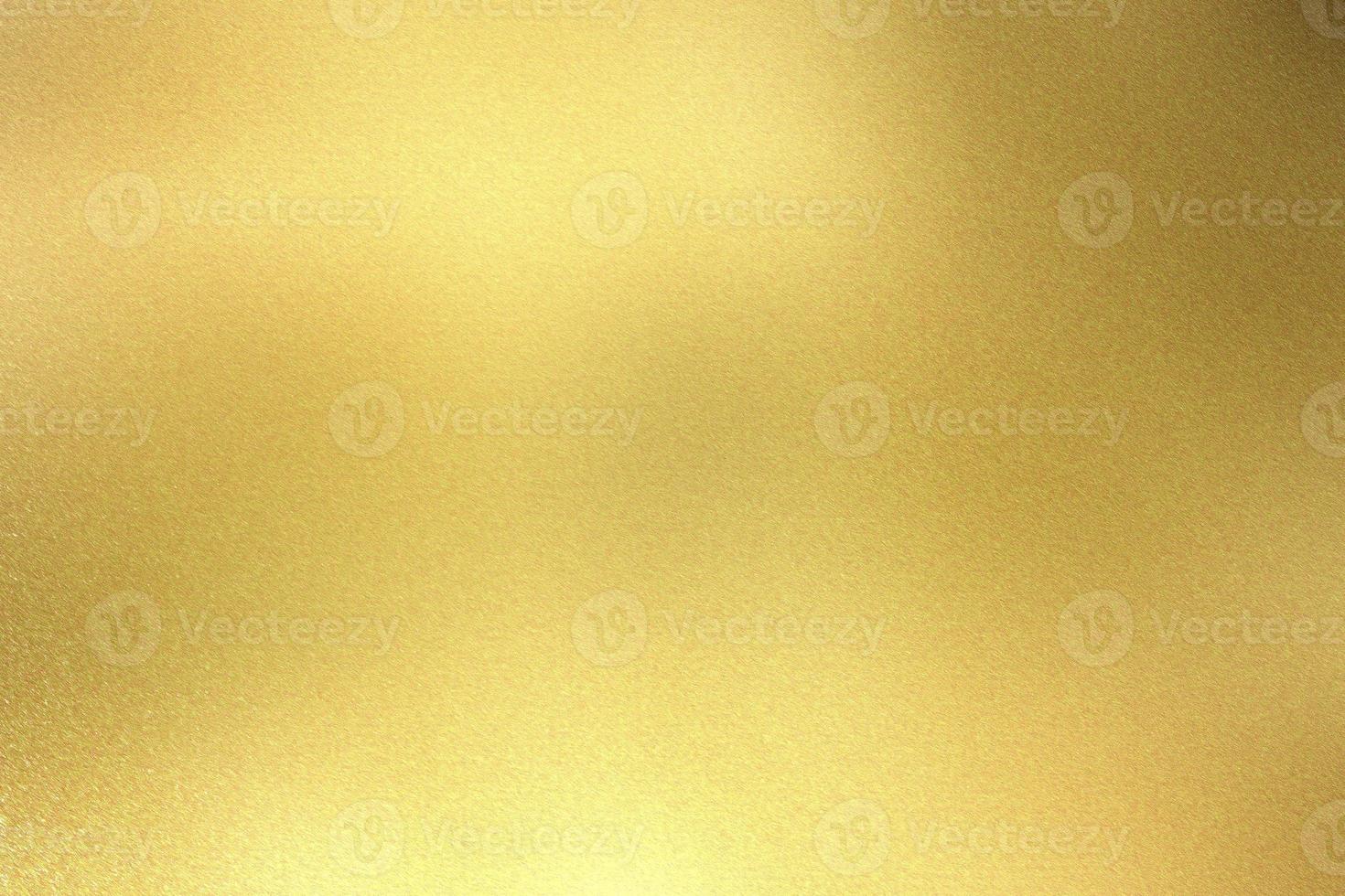 Brushed gold metallic wall with scratched surface, abstract texture background photo
