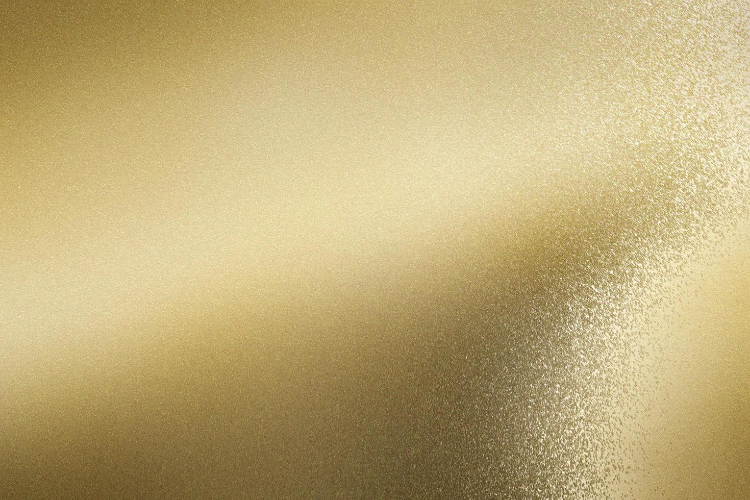 hoja metálica de hoja de oro cepillado brillante, fondo de textura abstracta foto