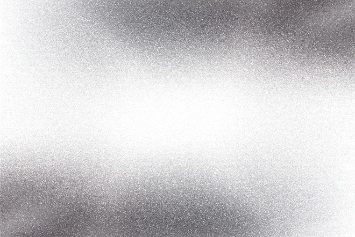 Glowing silver foil metal sheet wall with copy space, abstract texture background photo