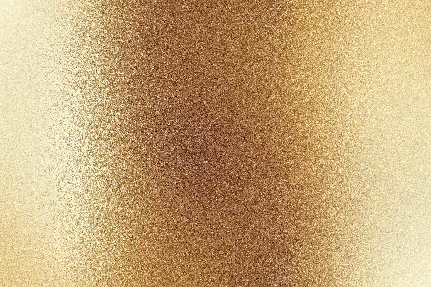 Shiny brushed bronze metallic wall, abstract texture background photo