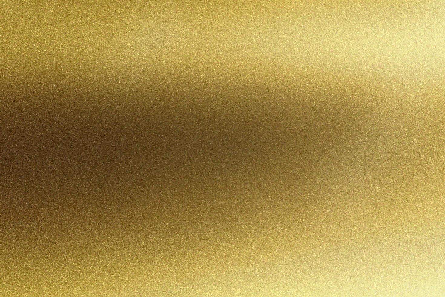 Abstract texture background, shiny polished gold metallic plate photo