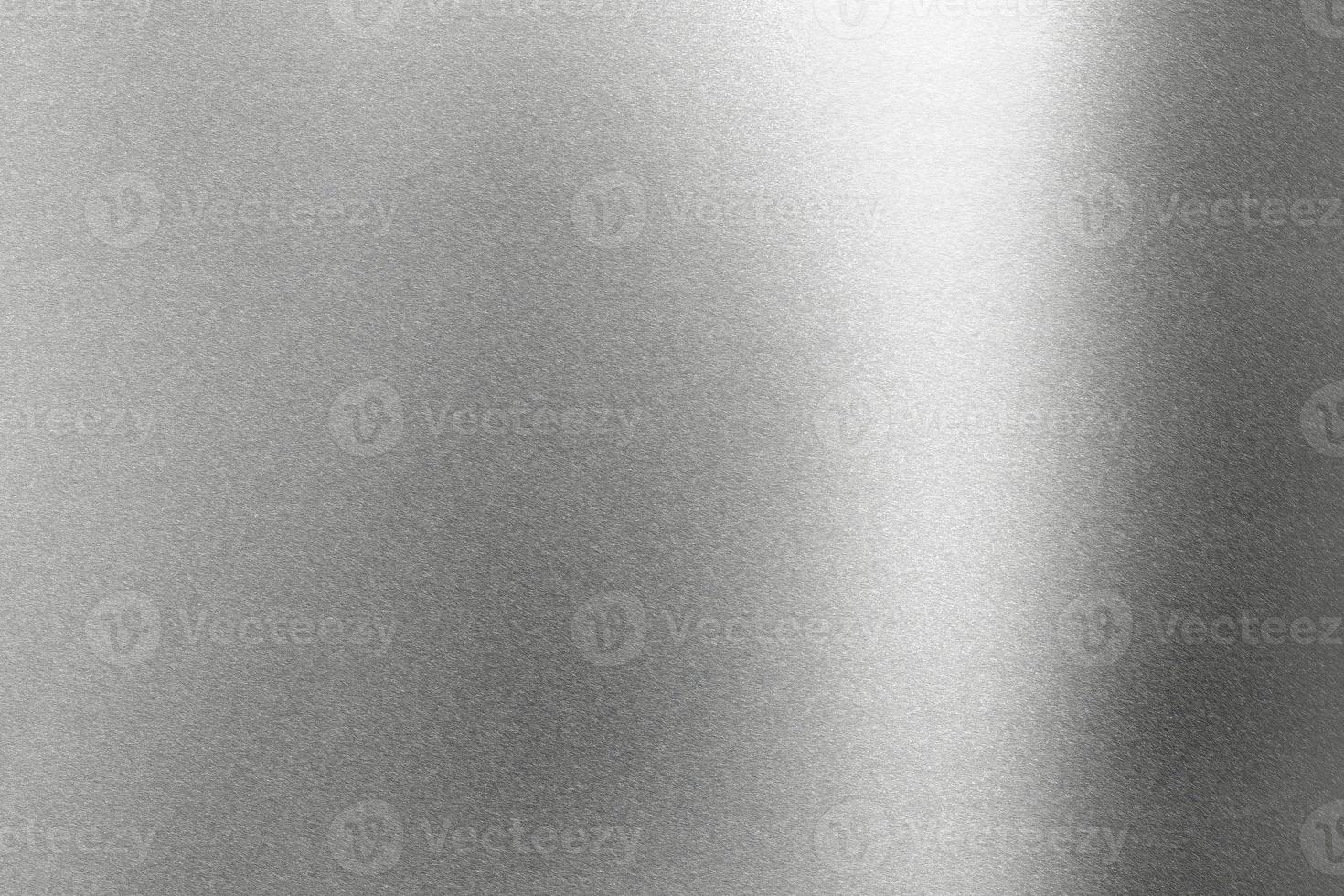 Light shining on rough gray metal wall, abstract texture background photo