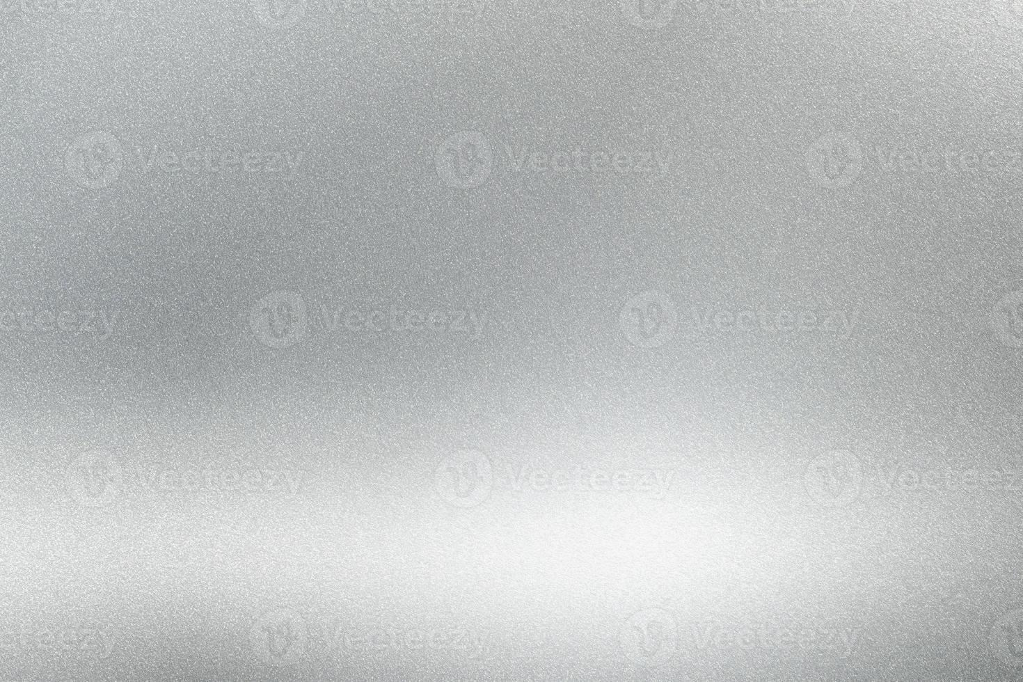 Abstract texture background, light shining on rough silver metallic wall photo