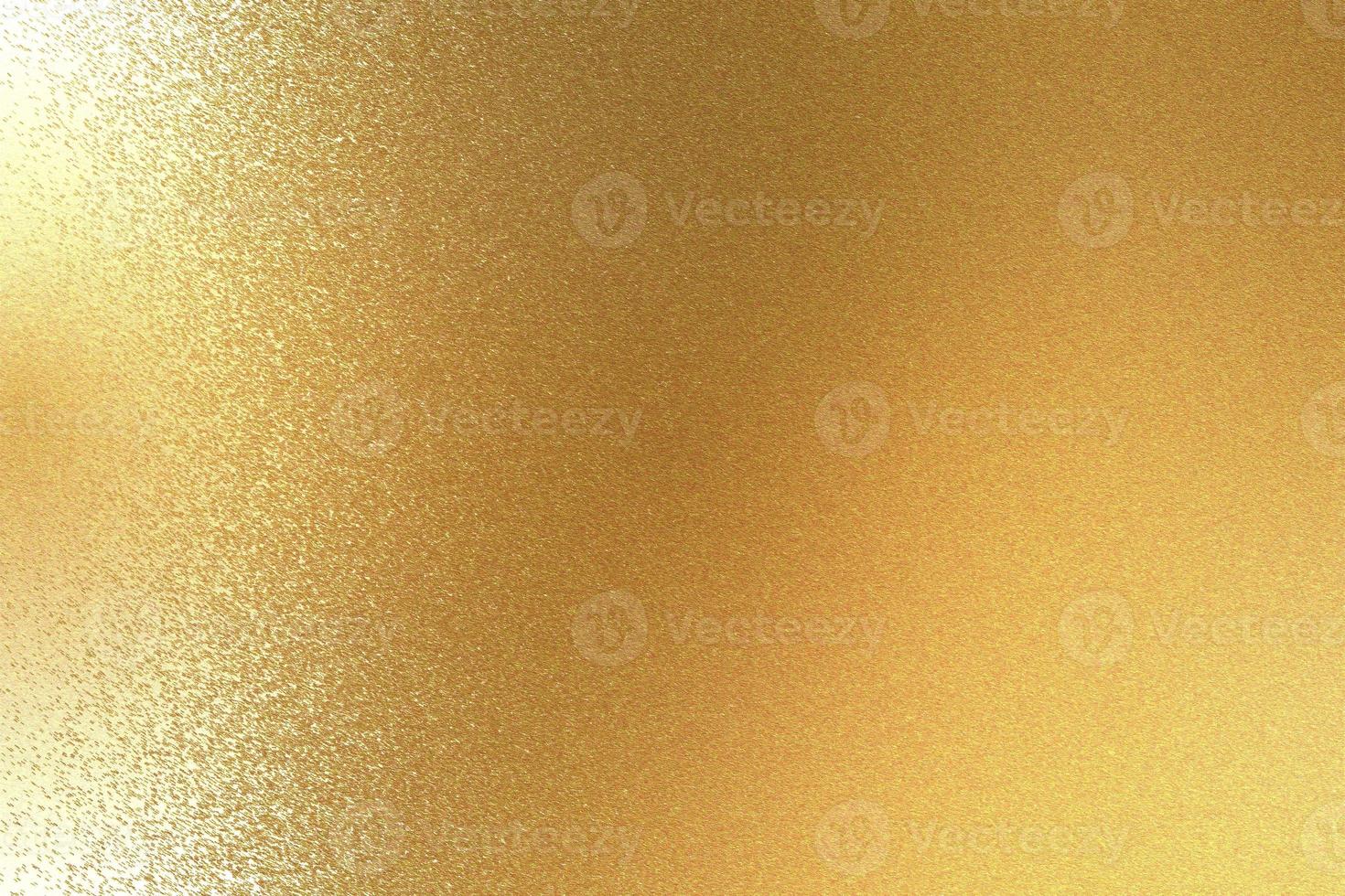 Texture of reflection on rough light gold metal sheet, abstract