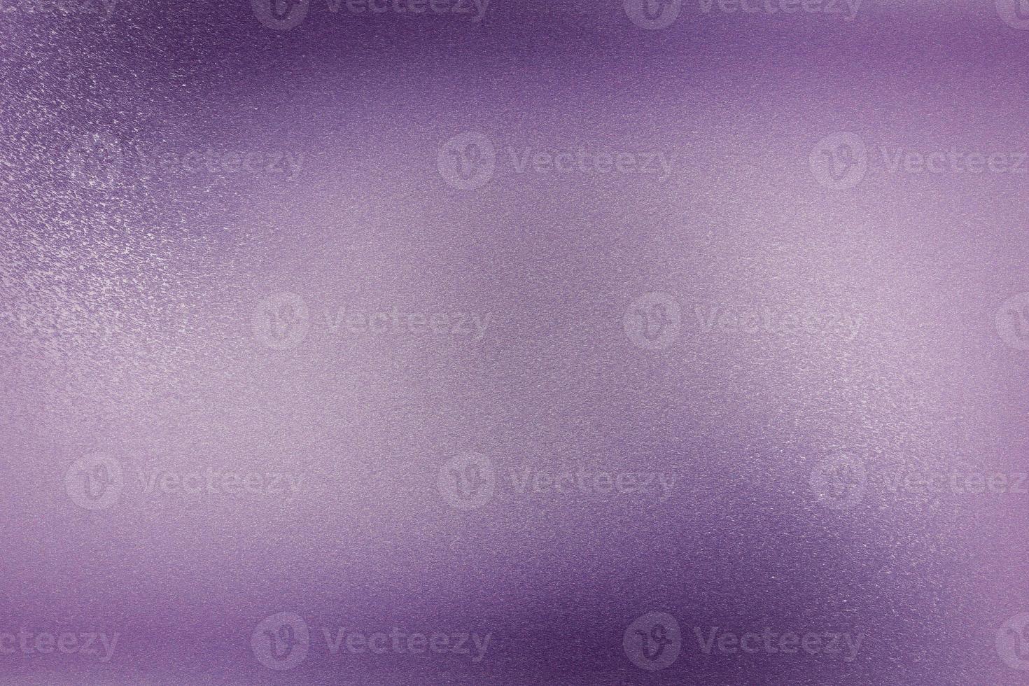 Brushed dark purple metallic wall with scratched surface, abstract texture background photo