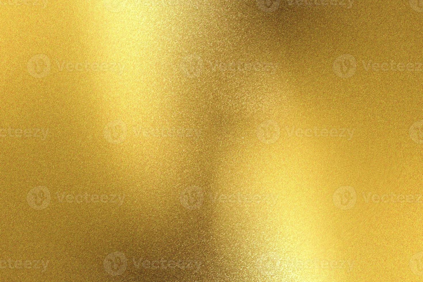 Glowing gold metallic wall surface, abstract background photo