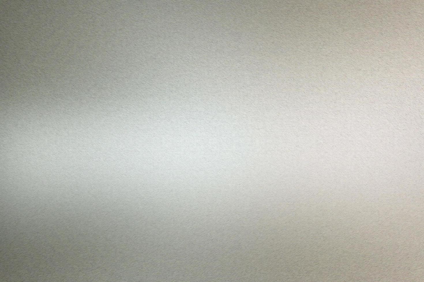Brushed silver metallic wall with scratched surface, abstract texture background photo