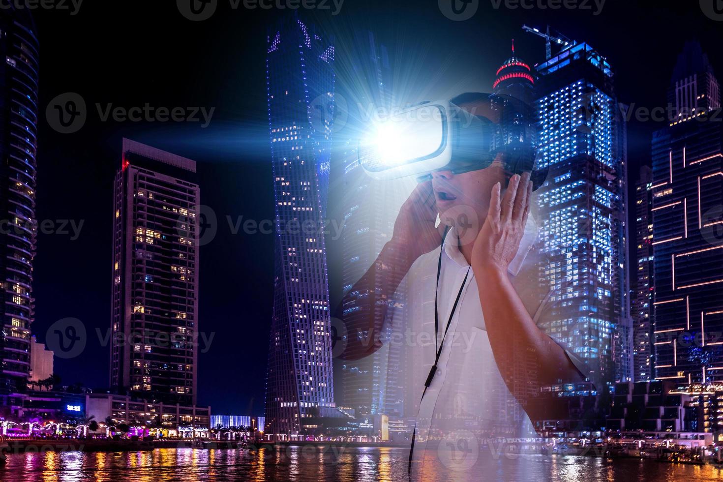 Defocus overlapping image of a man wearing virtual reality glasses and a modern building. Metaverse digital cyber technology concept. Future digital technology cyber virtual game entertainment. photo