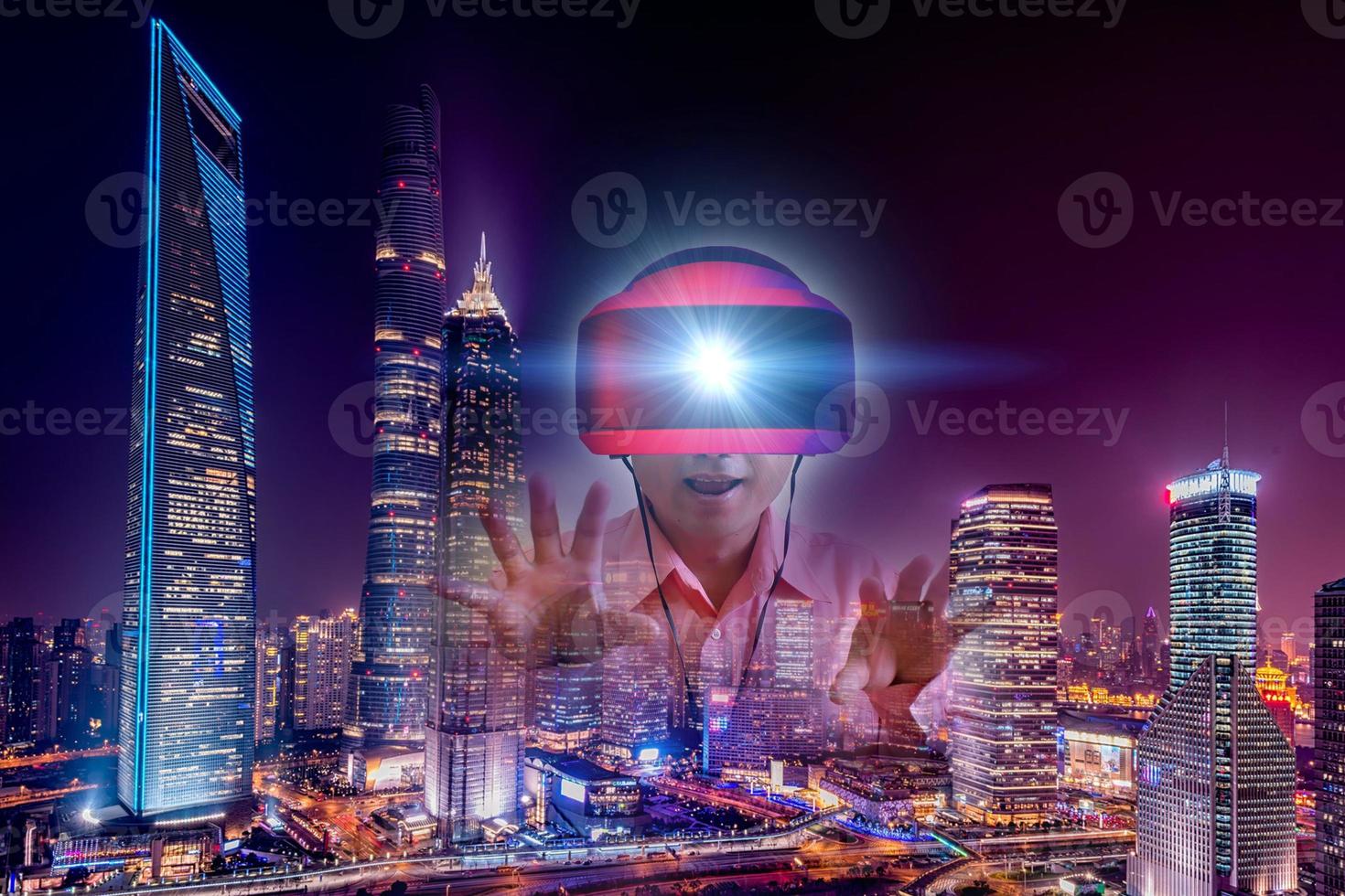 Defocus overlapping image of a man wearing virtual reality glasses and a modern building. Metaverse digital cyber technology concept. Future digital technology cyber virtual game entertainment. photo