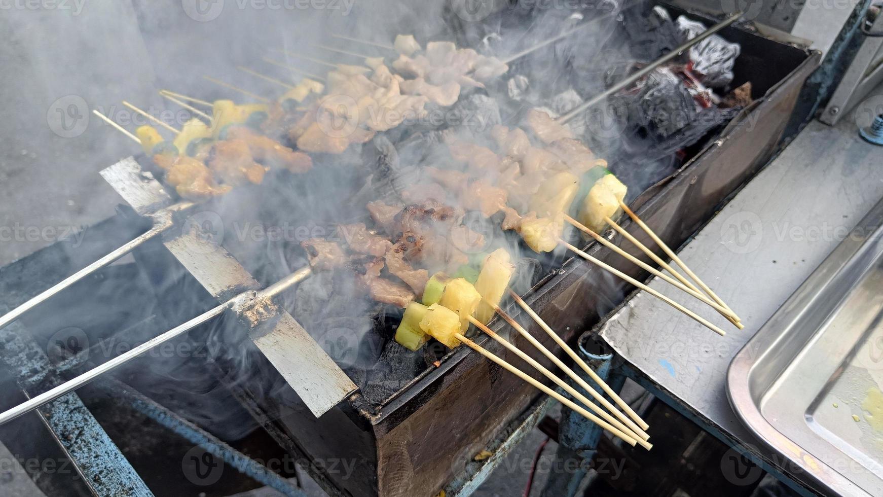 Meat skewers bbq for grilling on the coal grate photo