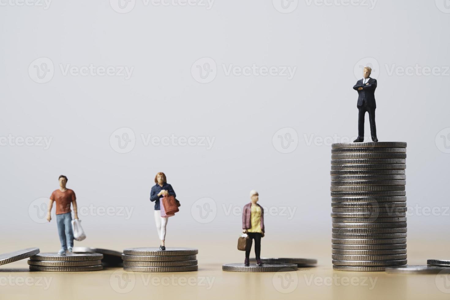 Businessman standing on highest coins stacking and shopper standing on lower coins pile for investment can make more money and opportunity to richer concept. photo