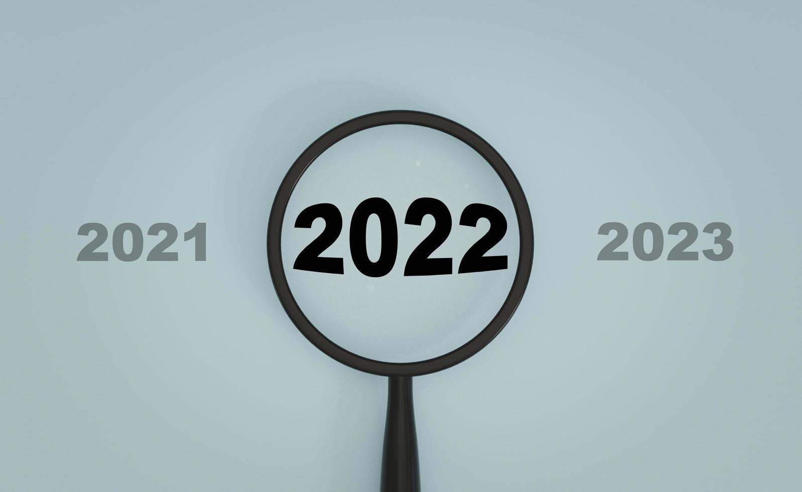 2022 year inside of magnifier glass between 2021 and 2023 on blue background for focus start new business in new year concept by 3d rendering. photo