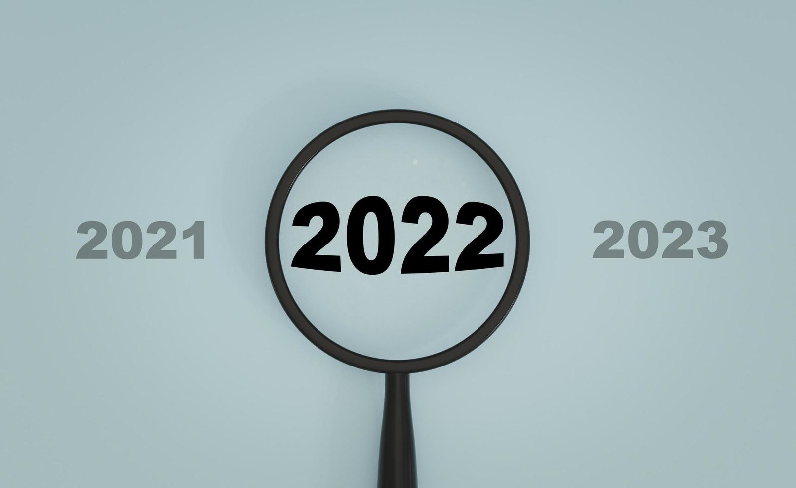 2022 año dentro de la lupa entre 2021 y 2023 sobre fondo azul para enfocarse en iniciar nuevos negocios en el concepto de año nuevo mediante representación 3d. foto